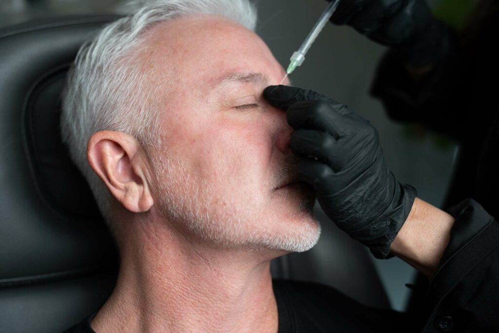 Men Getting Radiesse Treatment on his face in Las Vegas, NV | Center for Aesthetic Medicine